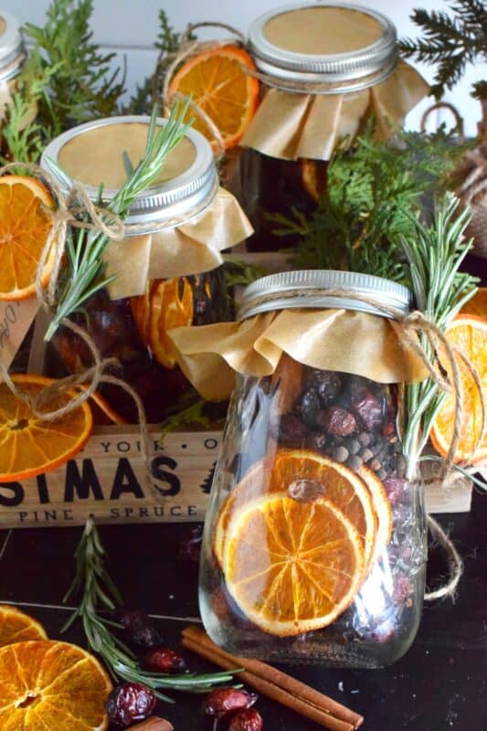 Prepare jars of Holiday Simmering Potpourri as a hostess gift or a holiday party favour, but be sure to keep one or two jars for yourself! You don't want to miss out on treating yourself to the spicy, sweet, Christmas-like scent that fills your entire home.  Just add water and place over low heat for hours of gorgeously delicious fragrance! #potpourri #gift #holiday #cinnamon #rosehip