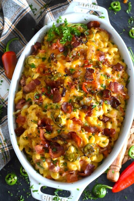 Macaroni and Cheese is always good even when it's bad, but you haven't tasted good until you've feasted on this Jalapeno Popper Mac and Cheese!  Not only is it the cheesiest and creamiest, but it's also loaded with jalapenos, crispy bacon, fresh green onions, and chopped tomatoes too! #macandcheese #macaroni #cheese #jalapeno #jalapenopopper